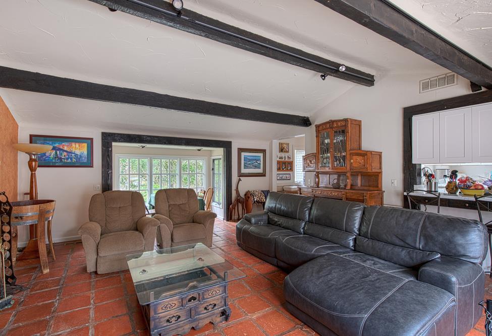 3041 Bird Rock Road Pebble Beach, CA 93953 - Photo 7 of 18 a living room with furniture and a large window