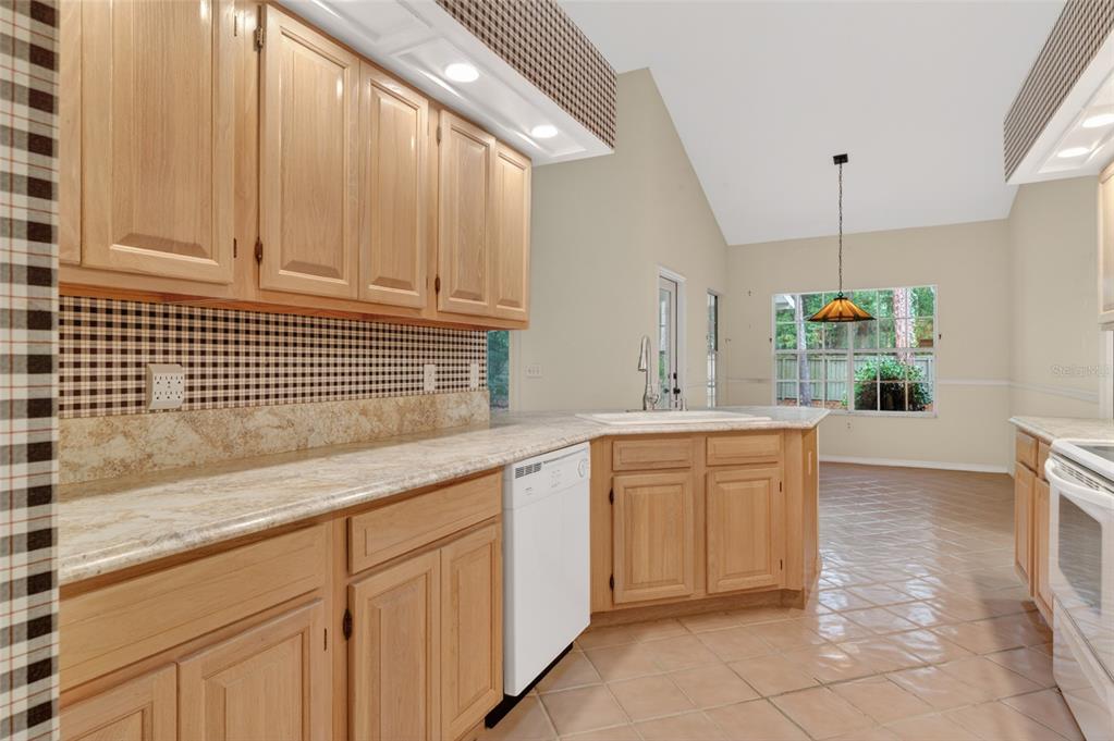 9626 Southwest 53rd Road Gainesville, FL 32608 - Photo 11 of 23 a kitchen with cabinets and window