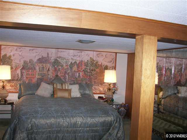 200 Bisby Street Reno, NV 89512 - Photo 11 of 13 a bed sitting in a room next to a window
