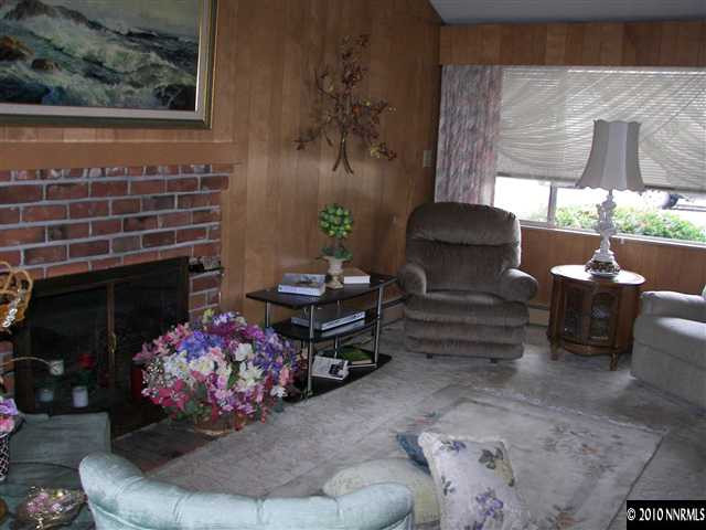 200 Bisby Street Reno, NV 89512 - Photo 9 of 13 a living room with furniture and a fireplace