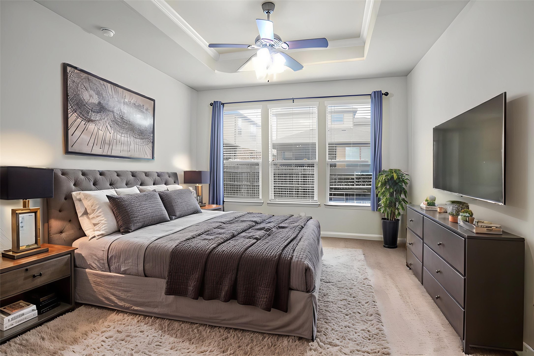 16012 McAloon Way Austin, TX 78728 - Photo 16 of 34 a bedroom with a large bed and a flat tv screen on a dresser