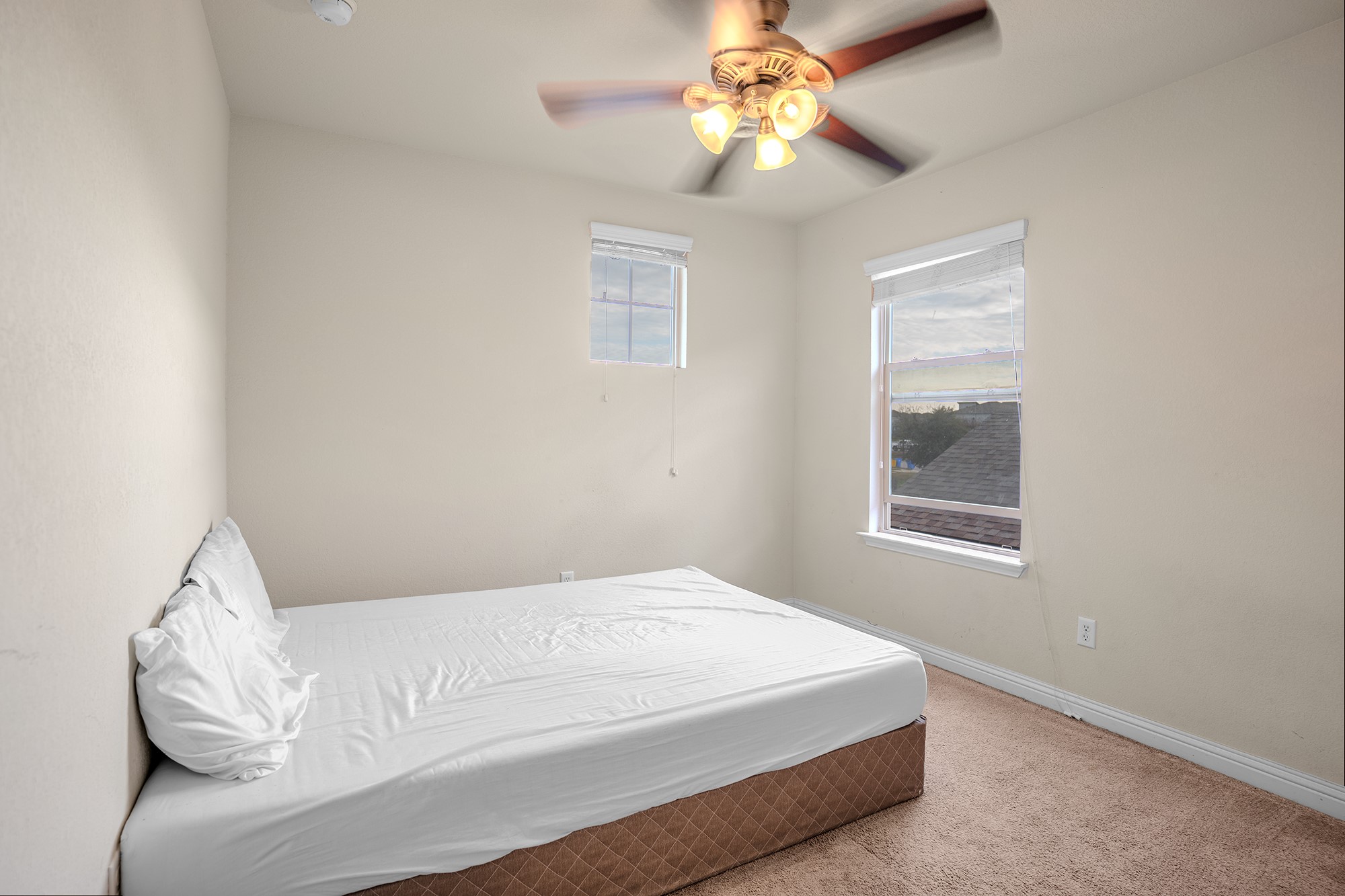 16012 McAloon Way Austin, TX 78728 - Photo 24 of 34 a bedroom with a bed and a window