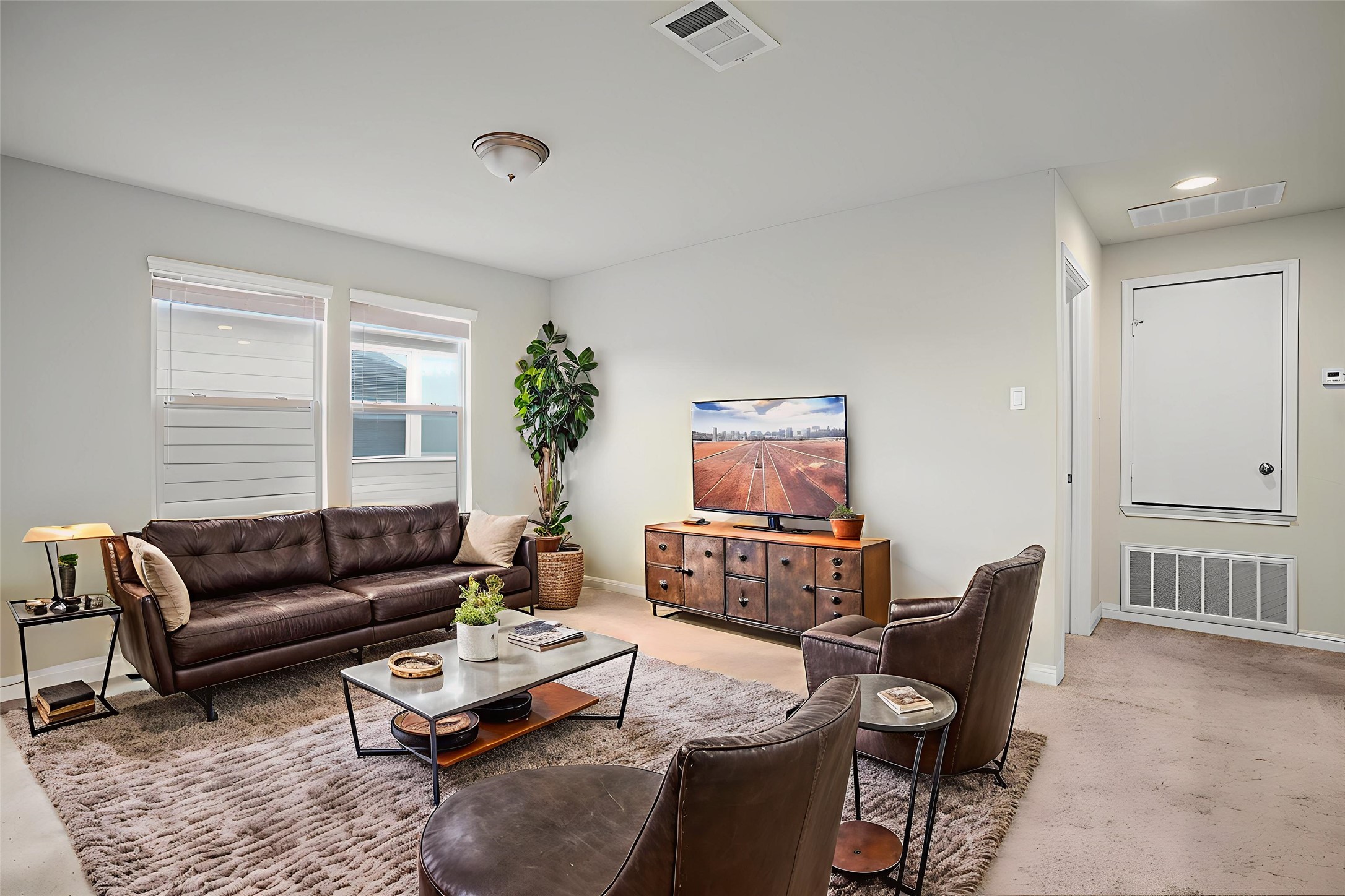 16012 McAloon Way Austin, TX 78728 - Photo 27 of 34 a living room with furniture a rug and a window