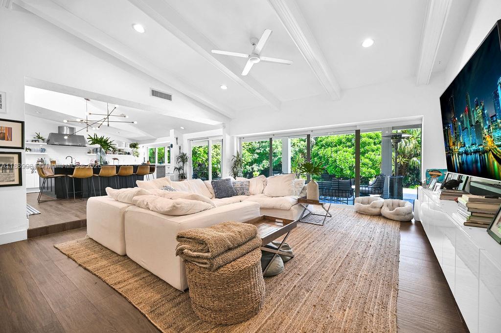 7761 Southwest 170th Street Palmetto Bay, FL 33157 - Photo 1 of 39 a living room with furniture and a large window