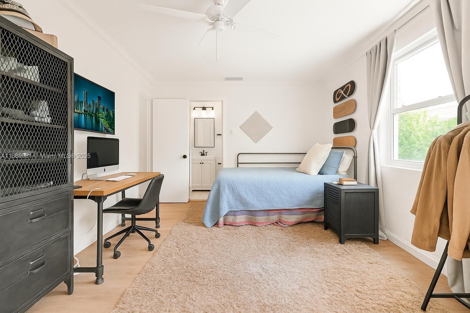 7761 Southwest 170th Street Palmetto Bay, FL 33157 - Photo 18 of 39 a bedroom with furniture and a window