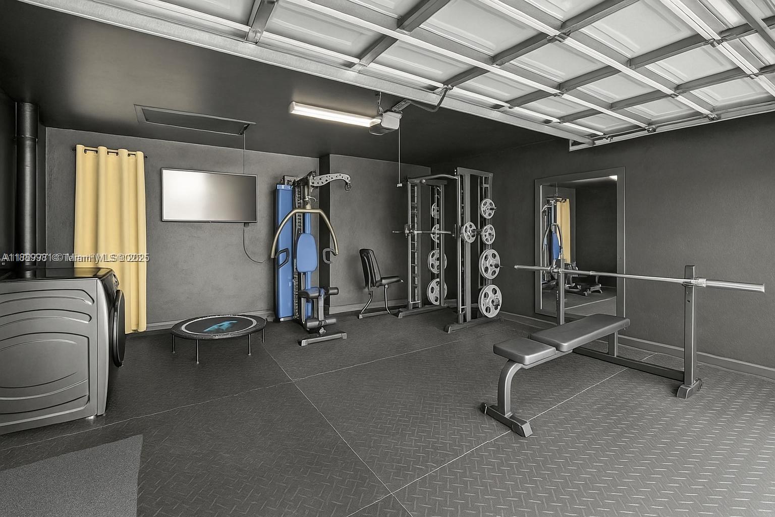 7761 Southwest 170th Street Palmetto Bay, FL 33157 - Photo 31 of 39 a view of a room with gym equipment