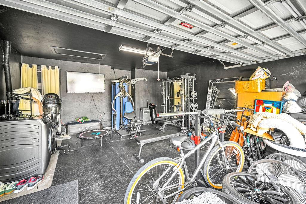 7761 Southwest 170th Street Palmetto Bay, FL 33157 - Photo 32 of 39 a view of a room with gym equipment