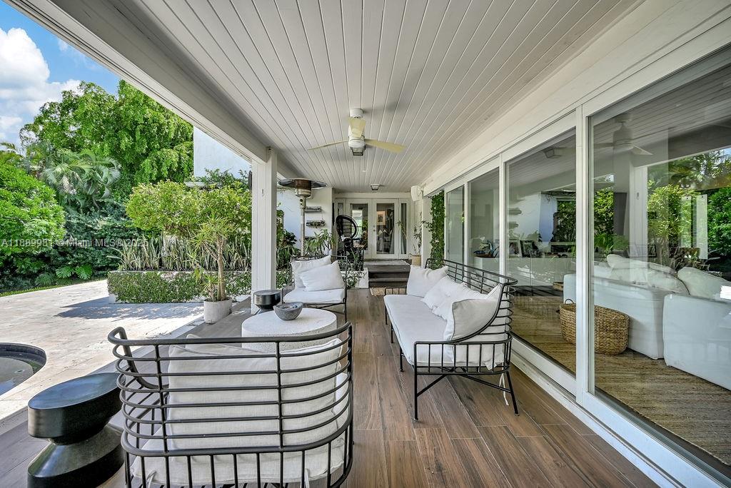 7761 Southwest 170th Street Palmetto Bay, FL 33157 - Photo 33 of 39 a view of a patio with a dining table and chairs