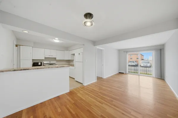 a view of a kitchen with microwave and cabinets