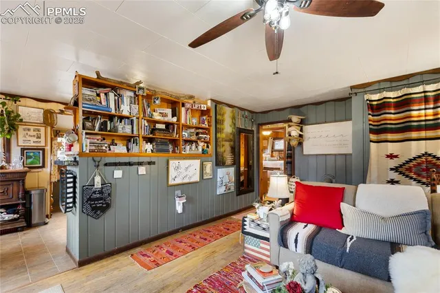 a living room with furniture cabinets and window