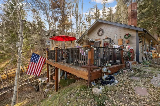 a wooden bench sitting in front of a house