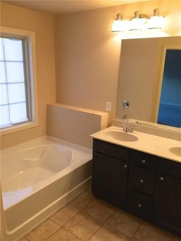 a bathroom with a sink and a bathtub