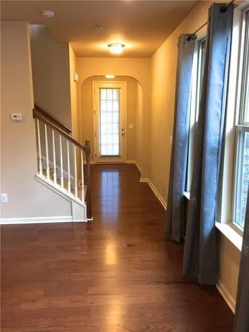 a view of an entryway door with wooden floor