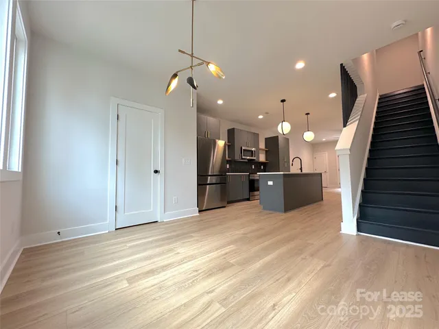 a view of a kitchen with a sink and a kitchen counter top