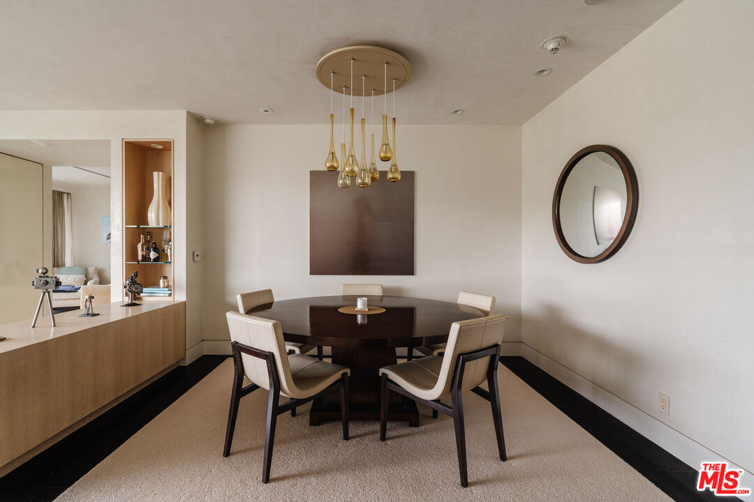 9255 Doheny Road, Unit 2603 West Hollywood, CA 90069 - Photo 2 of 17 a dining room with furniture and window