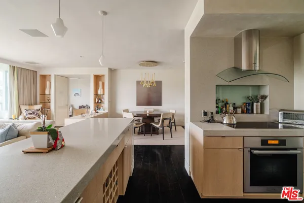 a view of living room with furniture and a chandelier