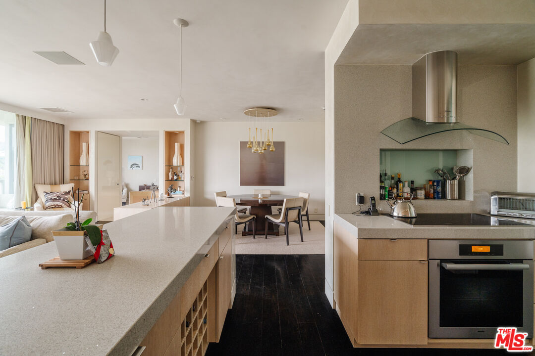 9255 Doheny Road, Unit 2603 West Hollywood, CA 90069 - Photo 3 of 17 a view of living room with furniture and a chandelier