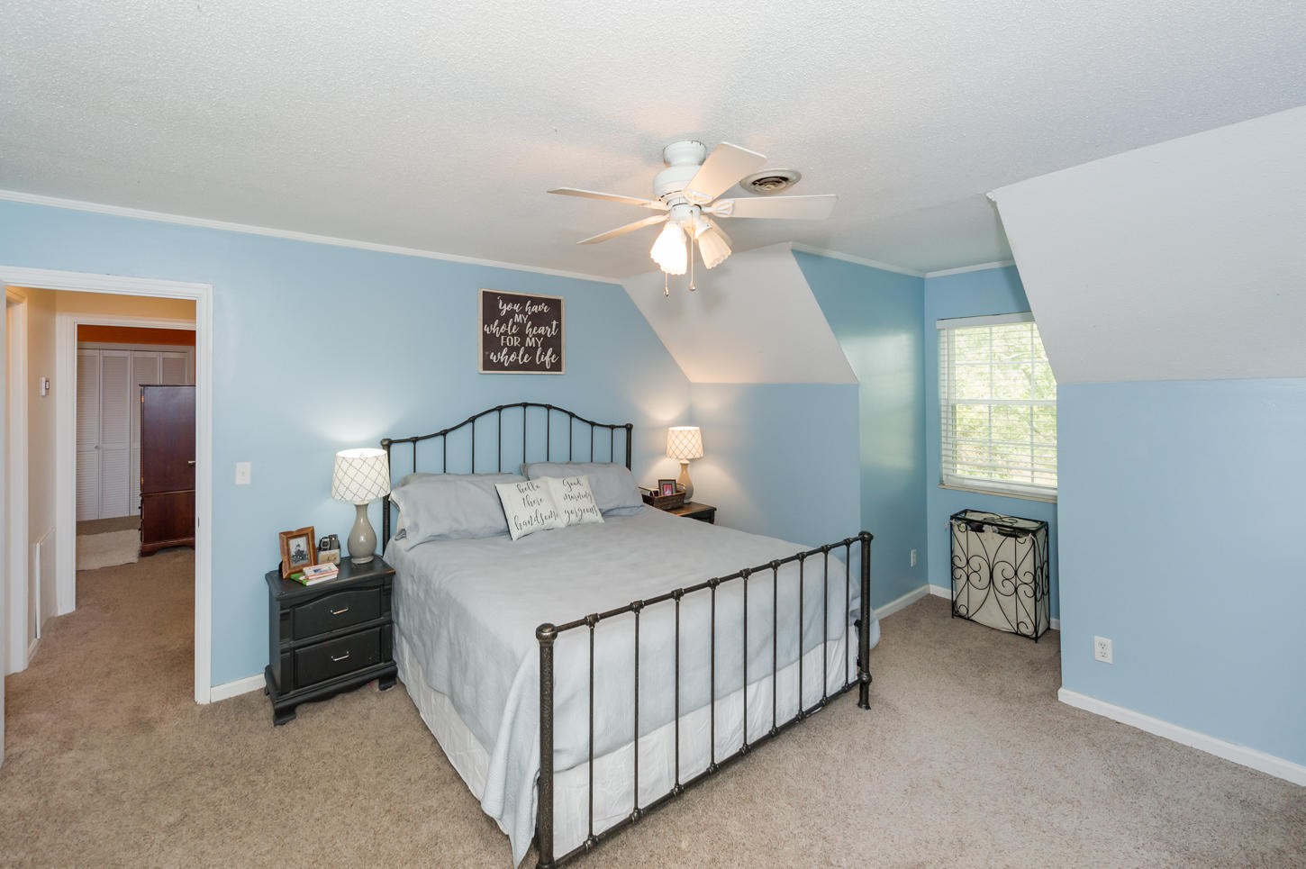 1118 Ridgeway Circle Athens, TN 37303 - Photo 21 of 30 a bedroom with a bed and a chandelier