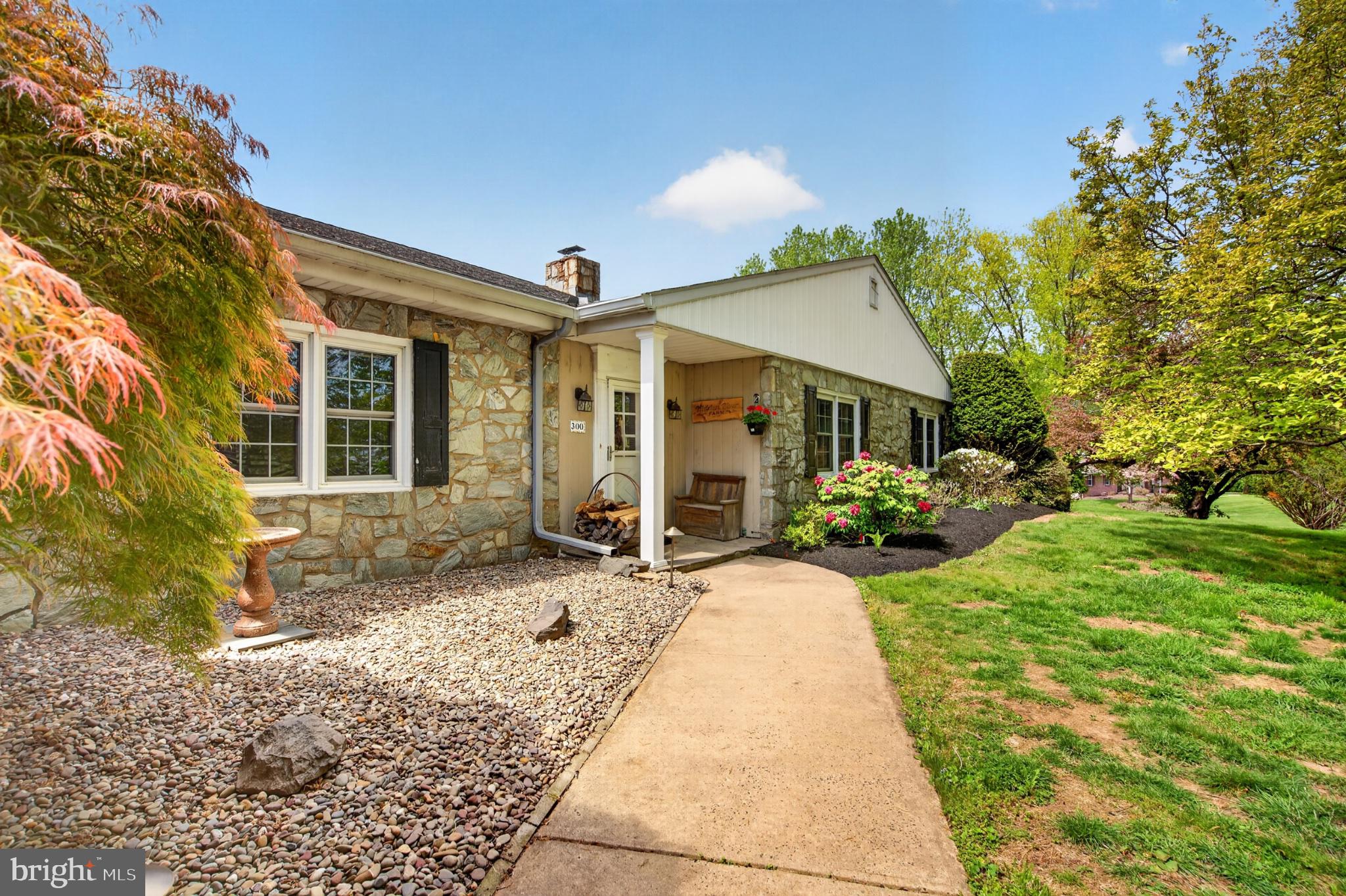300 Sanatoga Road Pottstown, PA 19465 - Photo 4 of 79 Charming stone-front home with lush greenery.