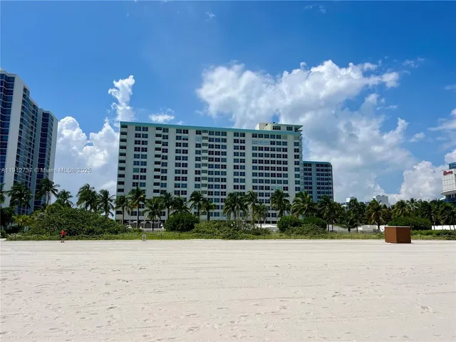 a view of a street with a building in the background