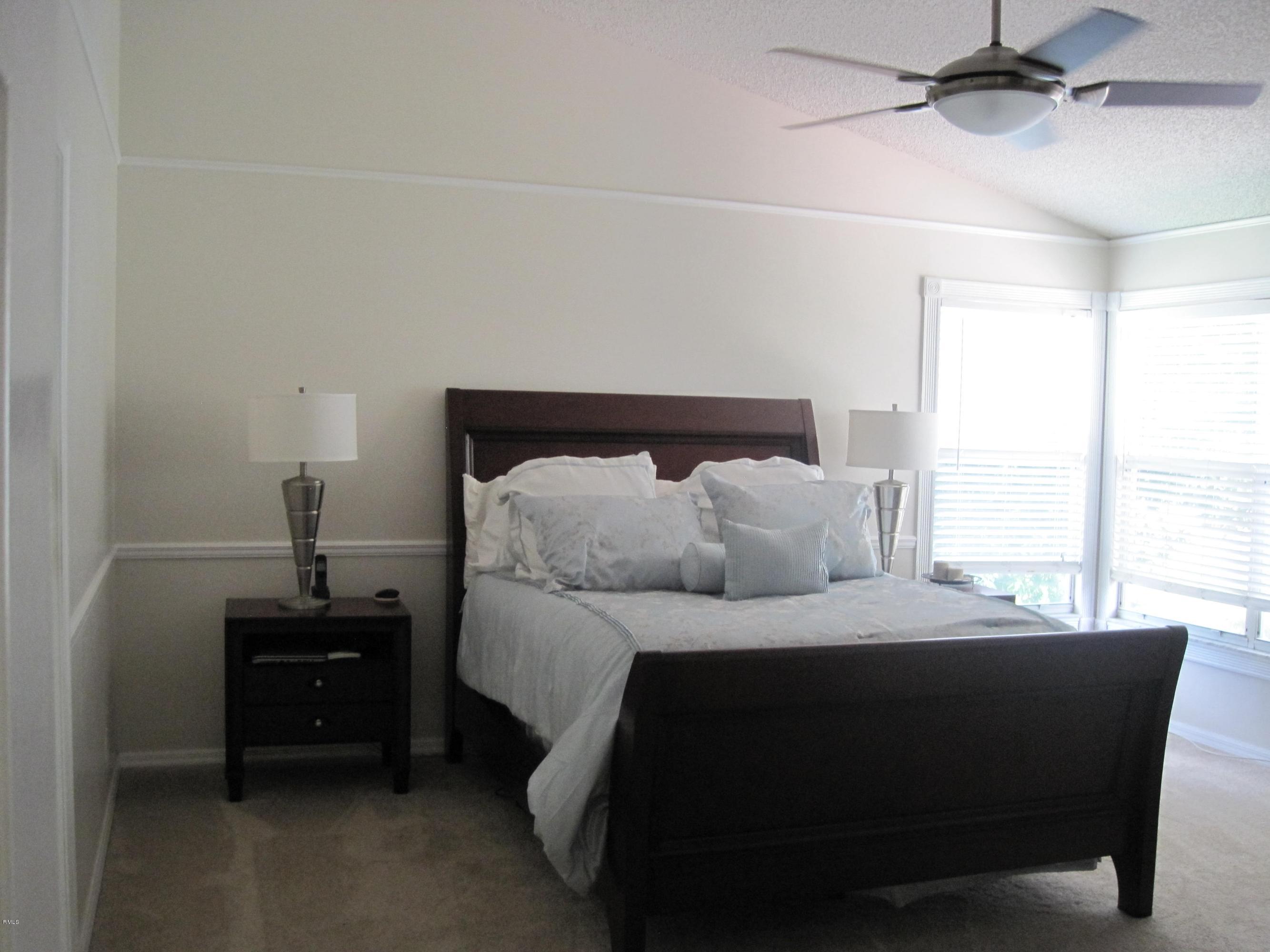 3930 Sabal Lakes Road Delray Beach, FL 33445 - Photo 14 of 30 a bedroom with a bed and a window