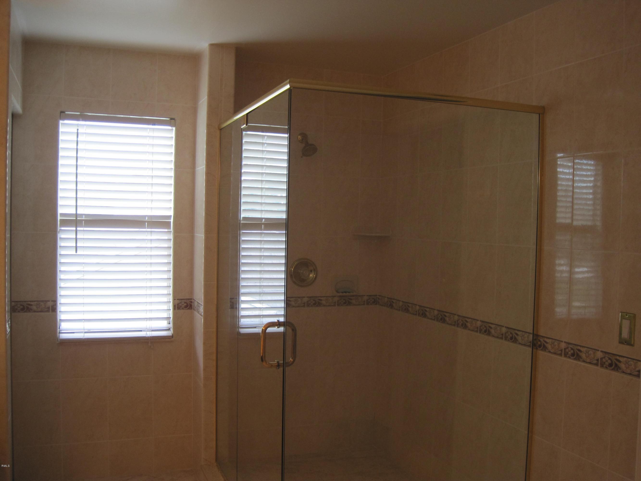 3930 Sabal Lakes Road Delray Beach, FL 33445 - Photo 15 of 30 a bathroom with a window