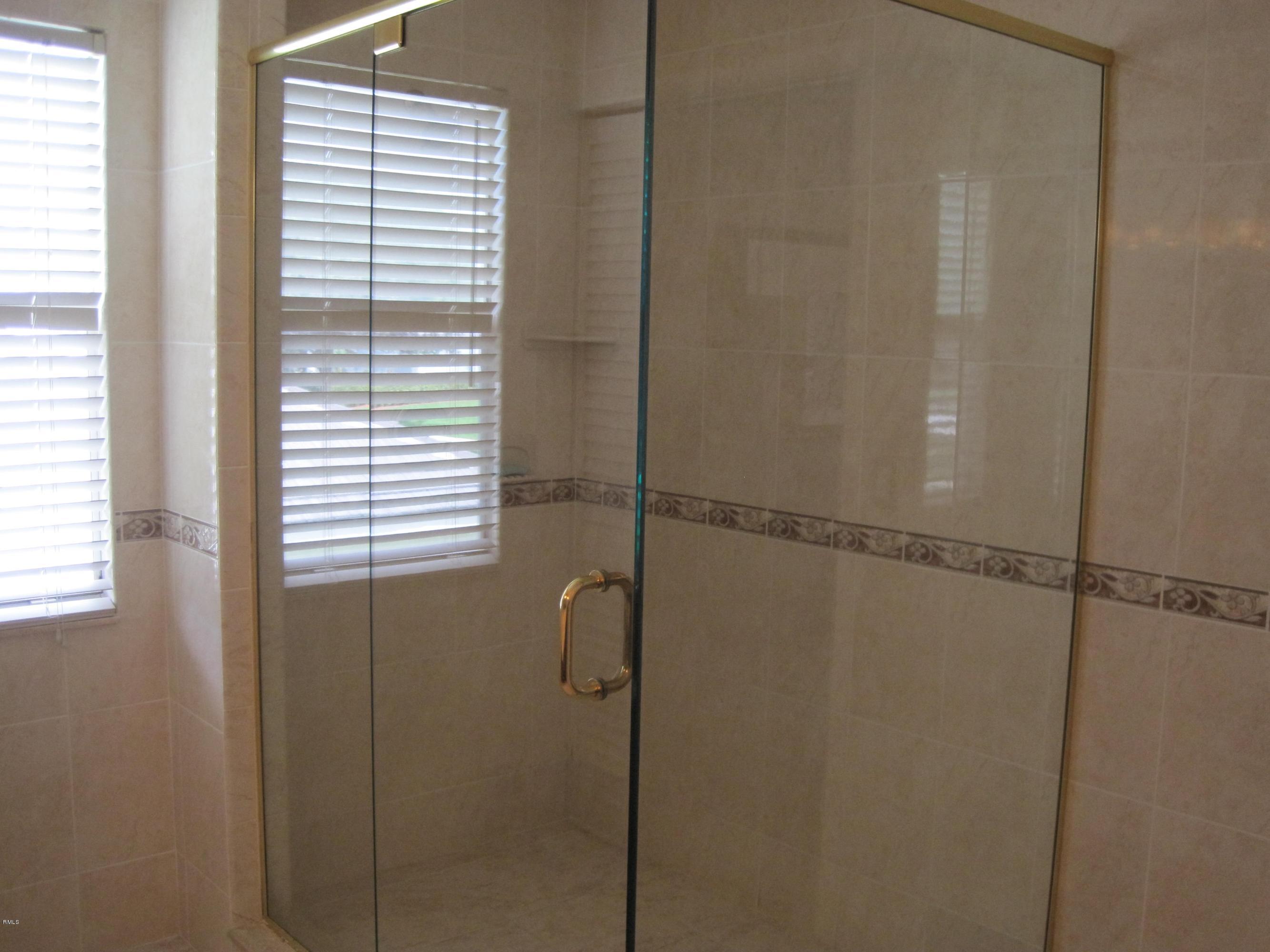 3930 Sabal Lakes Road Delray Beach, FL 33445 - Photo 17 of 30 a bathroom with a shower