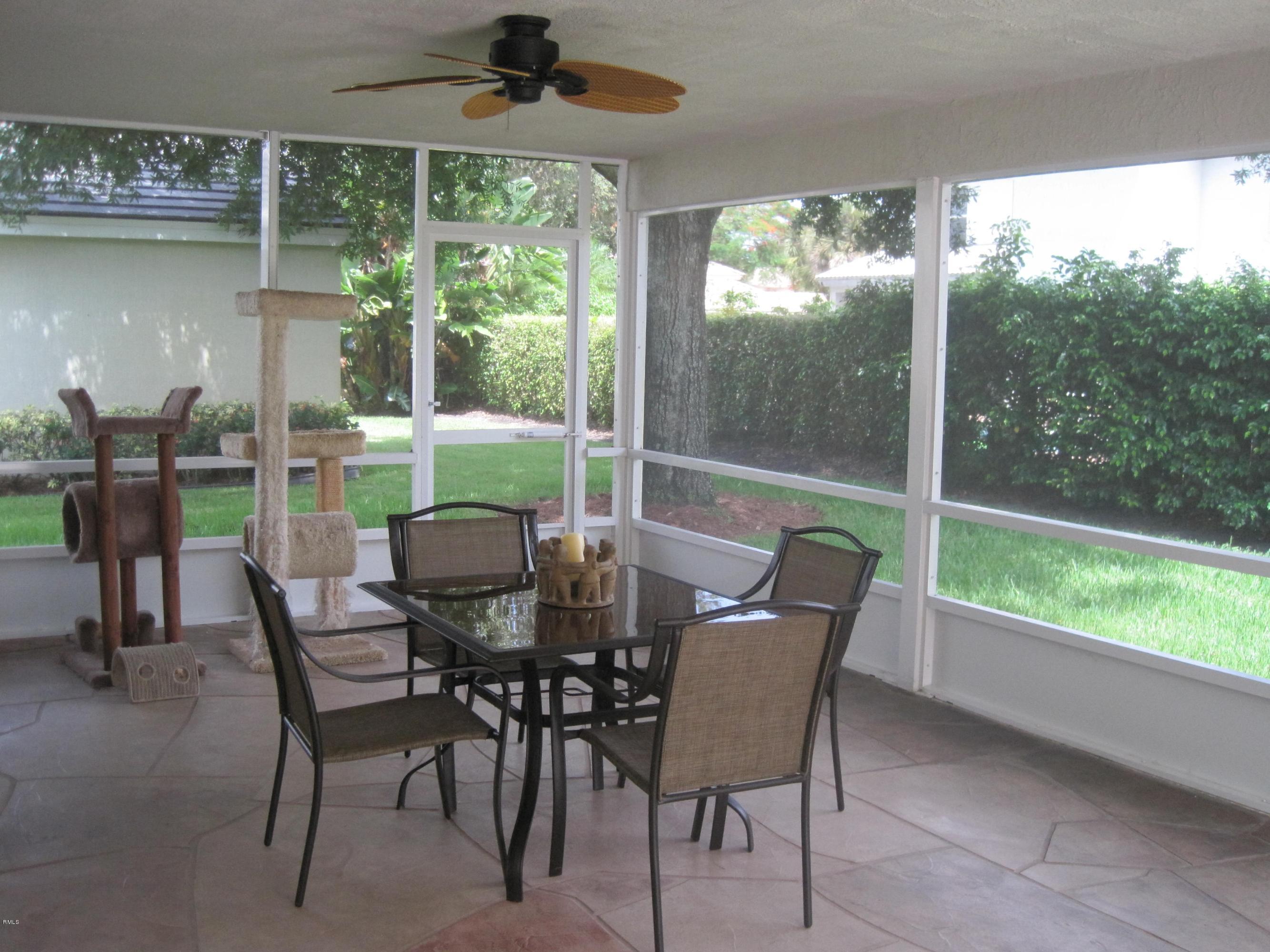 3930 Sabal Lakes Road Delray Beach, FL 33445 - Photo 23 of 30 a view of a dining room with furniture window and outside view
