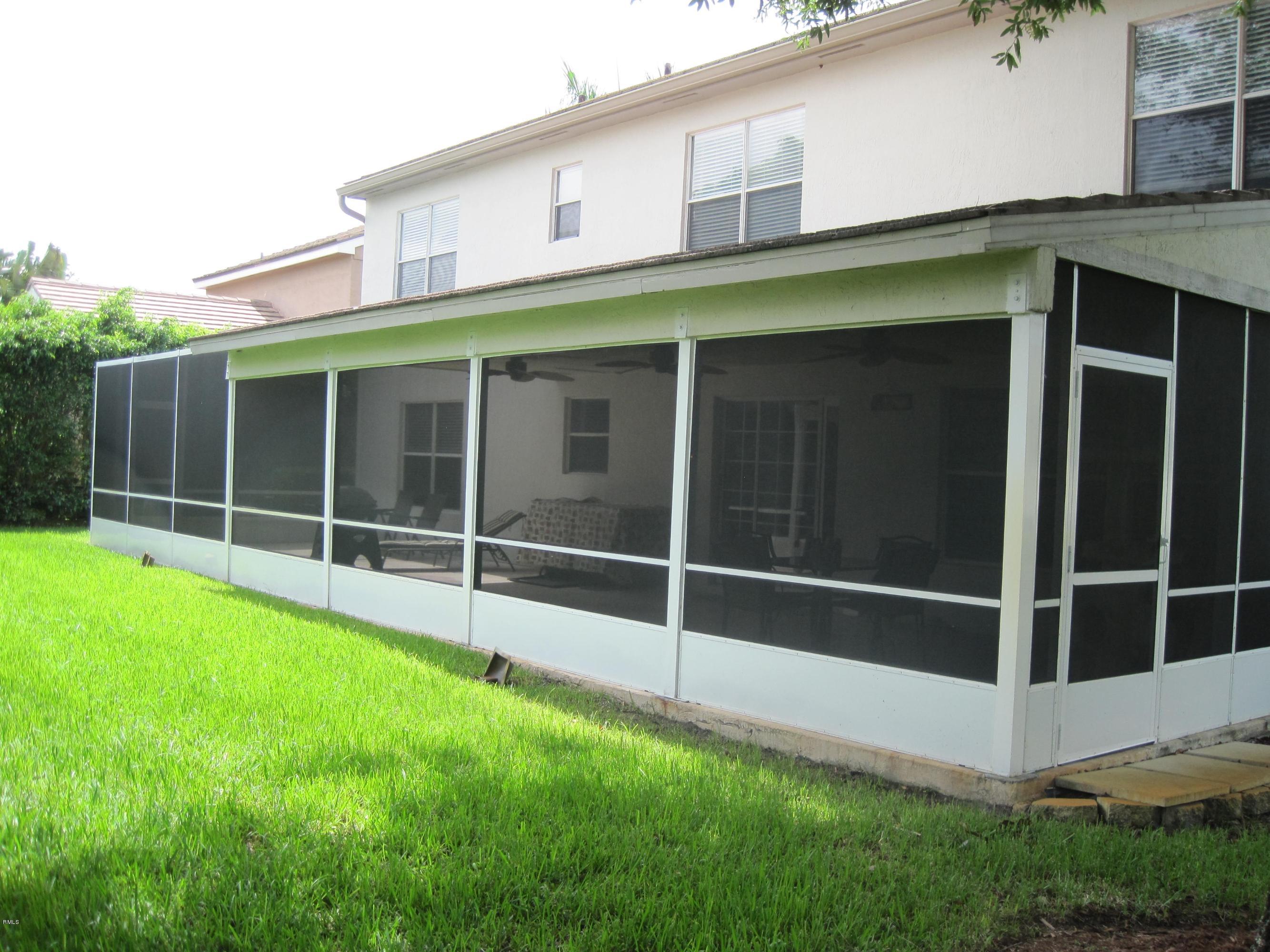 3930 Sabal Lakes Road Delray Beach, FL 33445 - Photo 25 of 30 a view of an house with backyard space and balcony