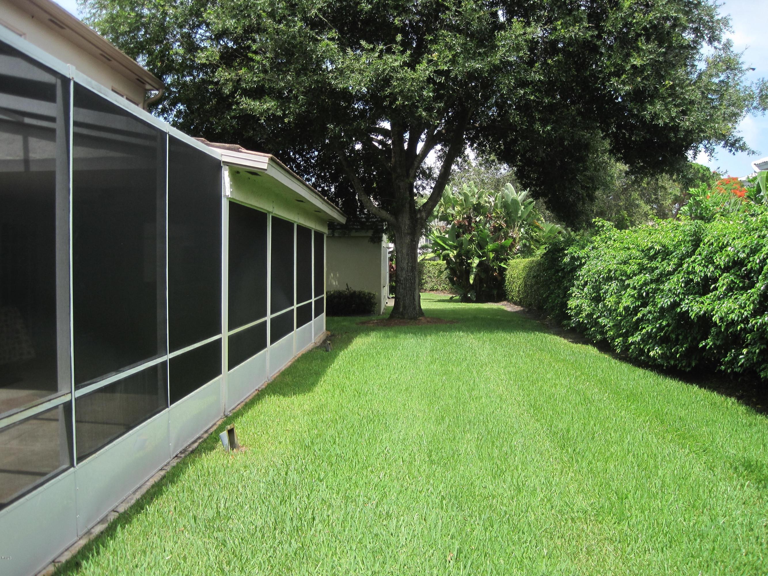3930 Sabal Lakes Road Delray Beach, FL 33445 - Photo 27 of 30 a view of an outdoor space with backyard