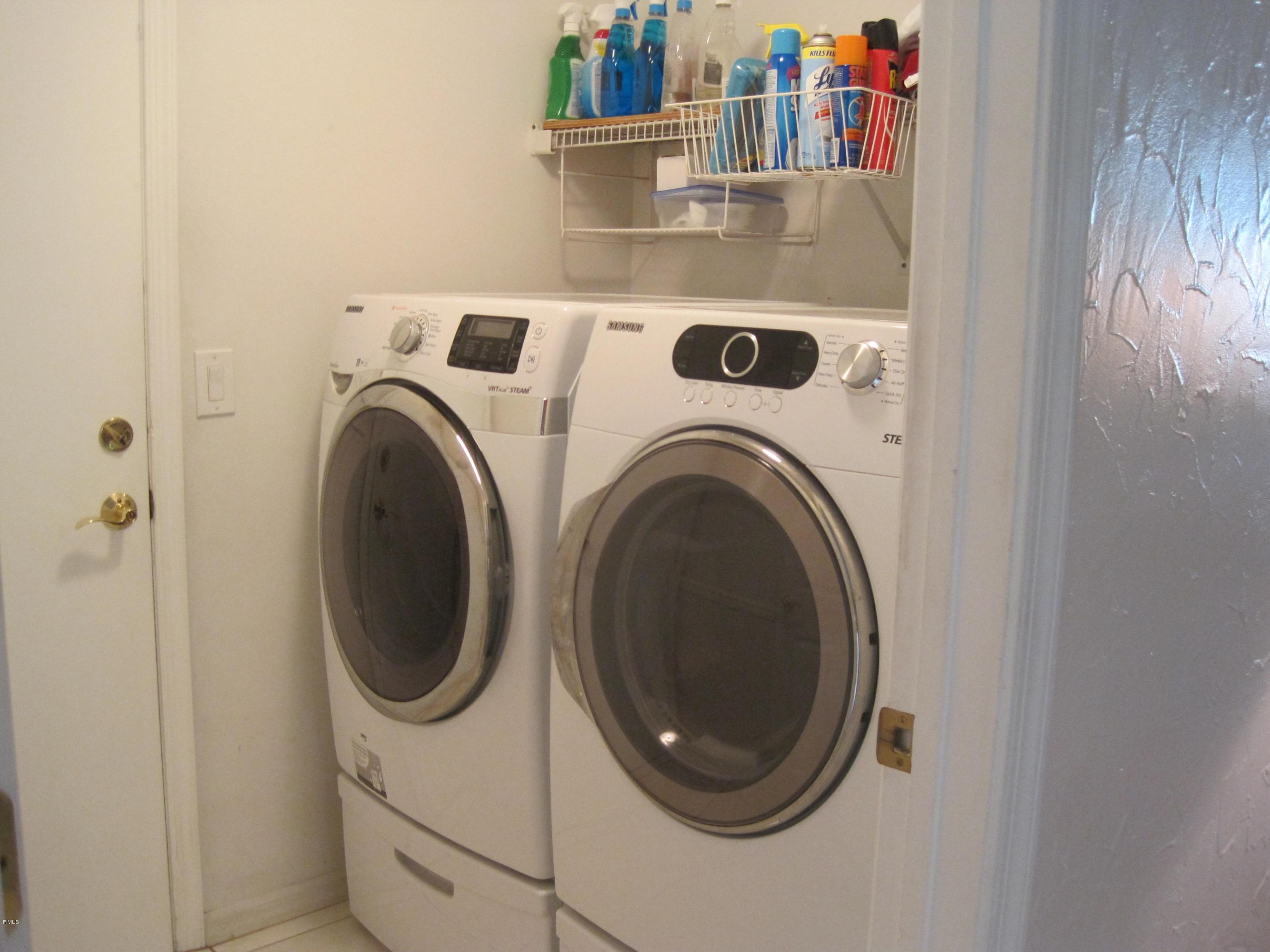 3930 Sabal Lakes Road Delray Beach, FL 33445 - Photo 3 of 30 a utility room with dryer and washer