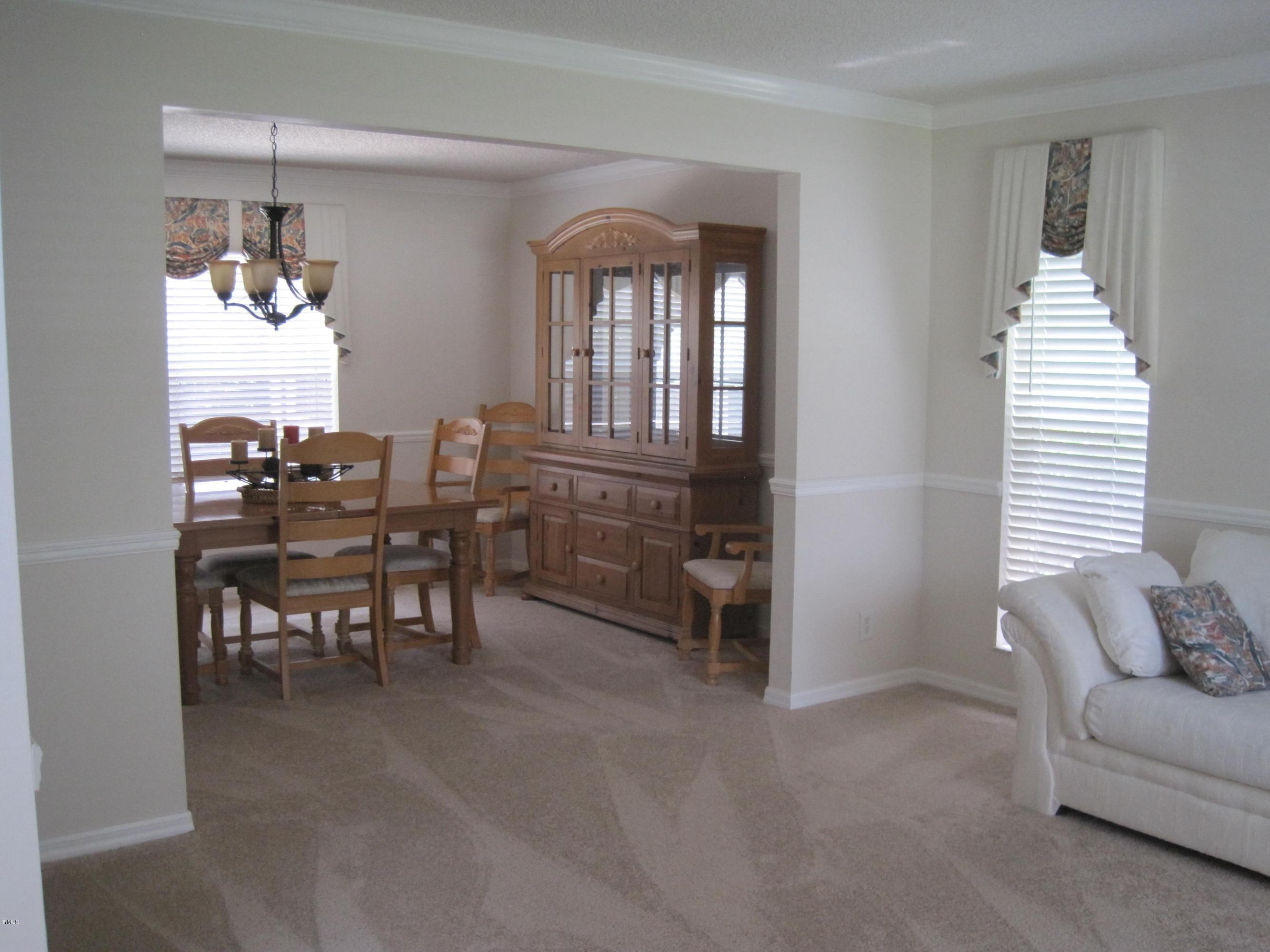 3930 Sabal Lakes Road Delray Beach, FL 33445 - Photo 6 of 30 a view of a livingroom with furniture and window