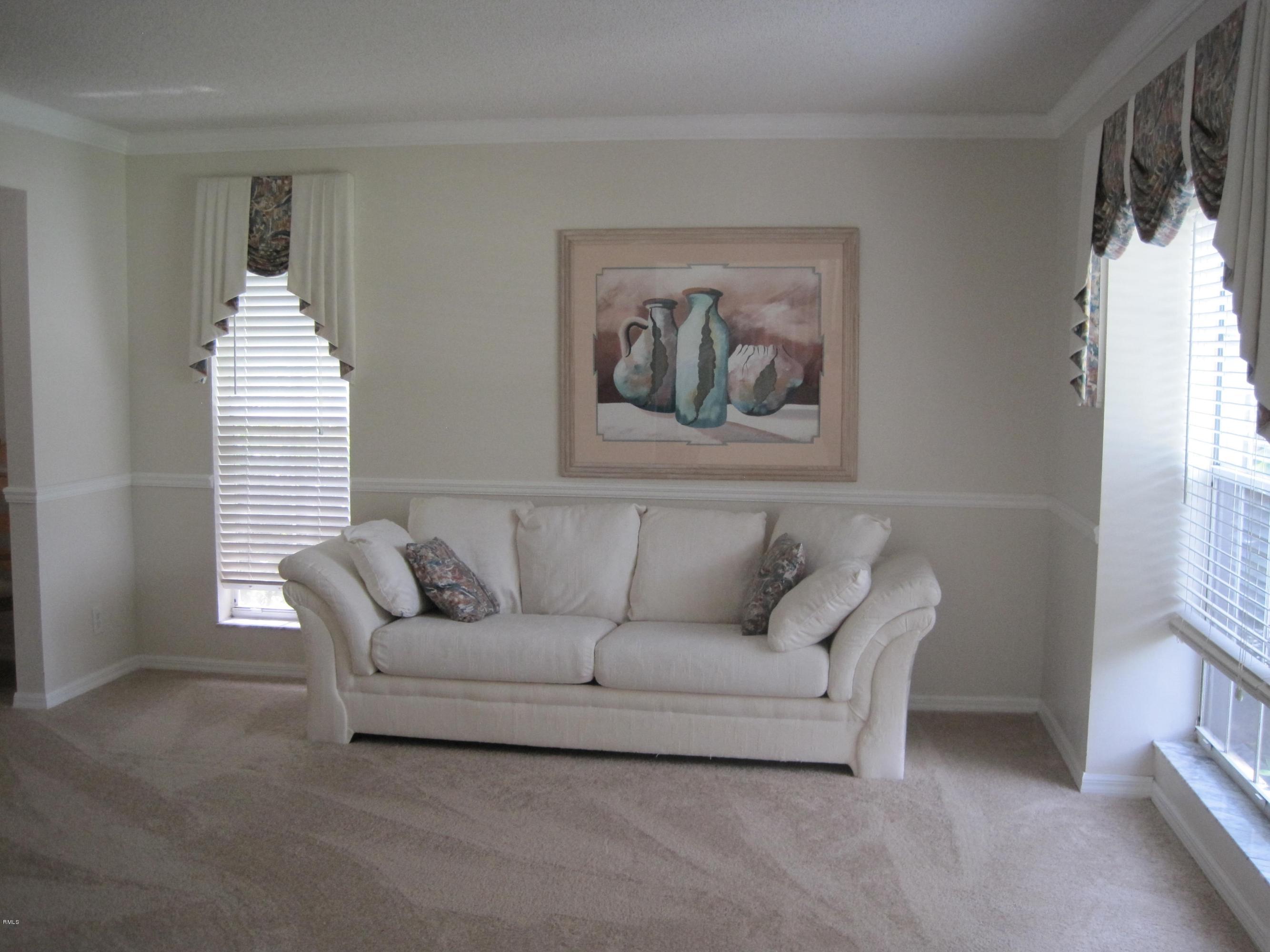 3930 Sabal Lakes Road Delray Beach, FL 33445 - Photo 8 of 30 a living room with furniture and a large window