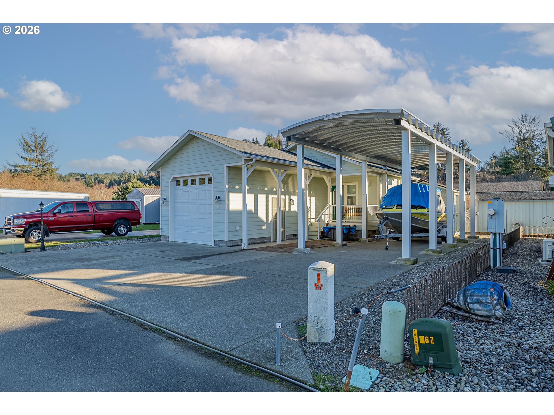 18 Pine Lane Lakeside, OR 97449 - Photo 1 of 33 a front view of a house with garden
