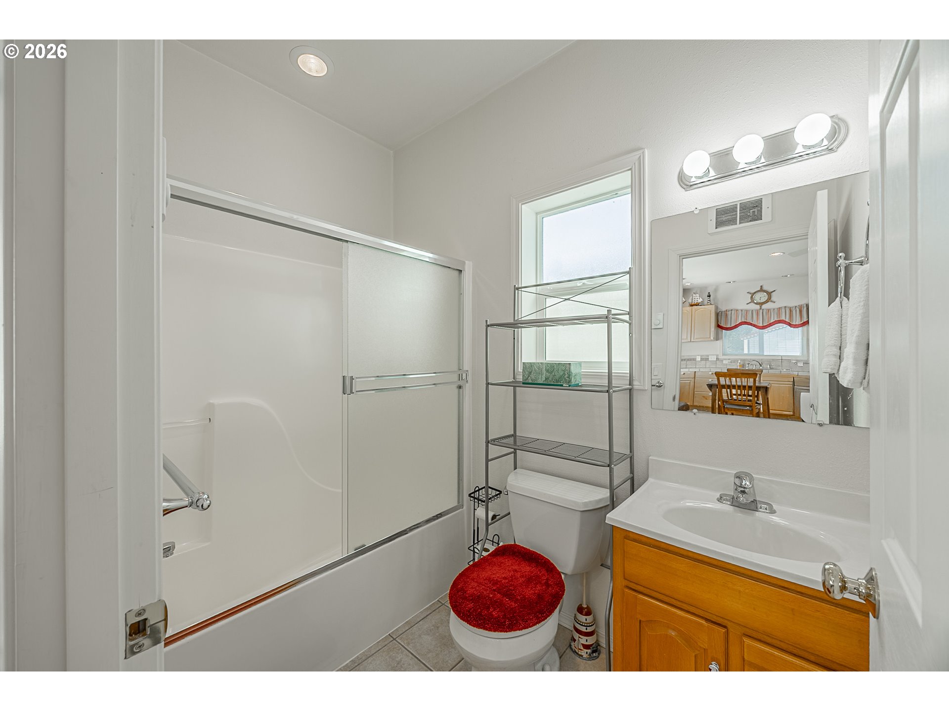18 Pine Lane Lakeside, OR 97449 - Photo 16 of 33 a bathroom with a granite countertop sink a mirror and shower