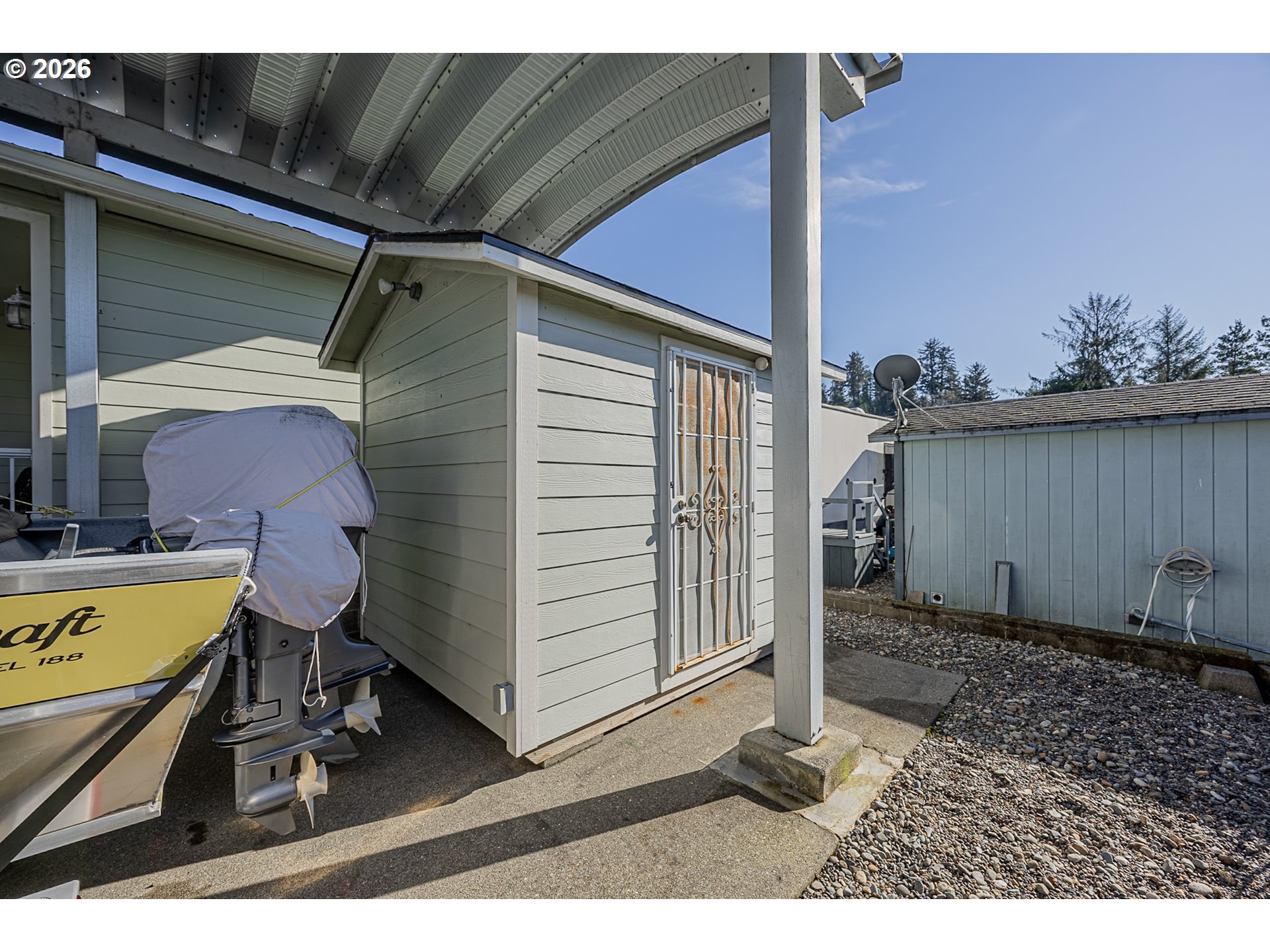 18 Pine Lane Lakeside, OR 97449 - Photo 21 of 33 a view of a backyard with a chair and a table