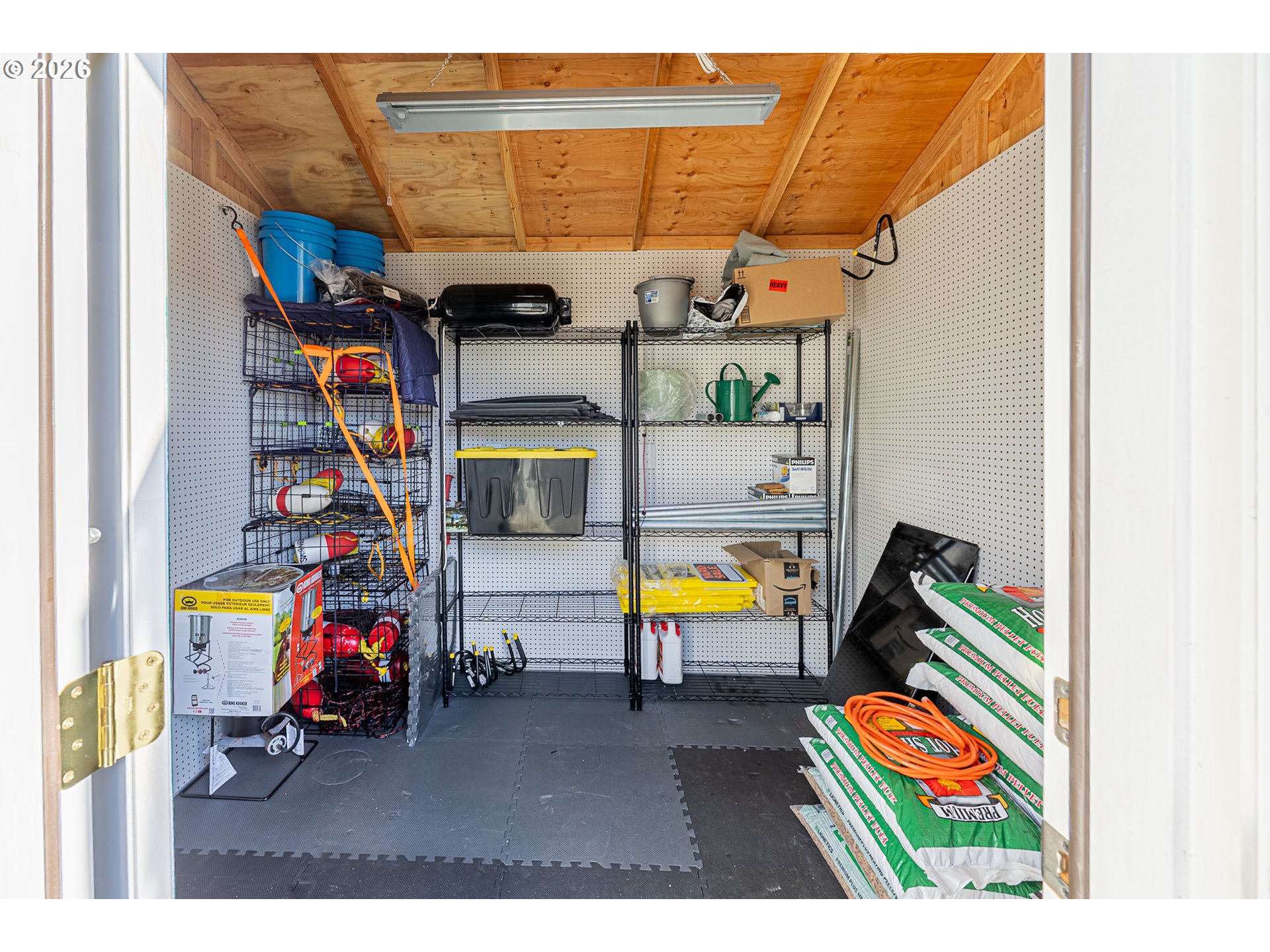 18 Pine Lane Lakeside, OR 97449 - Photo 23 of 33 a view of a swimming pool with a couch and a floor to ceiling window