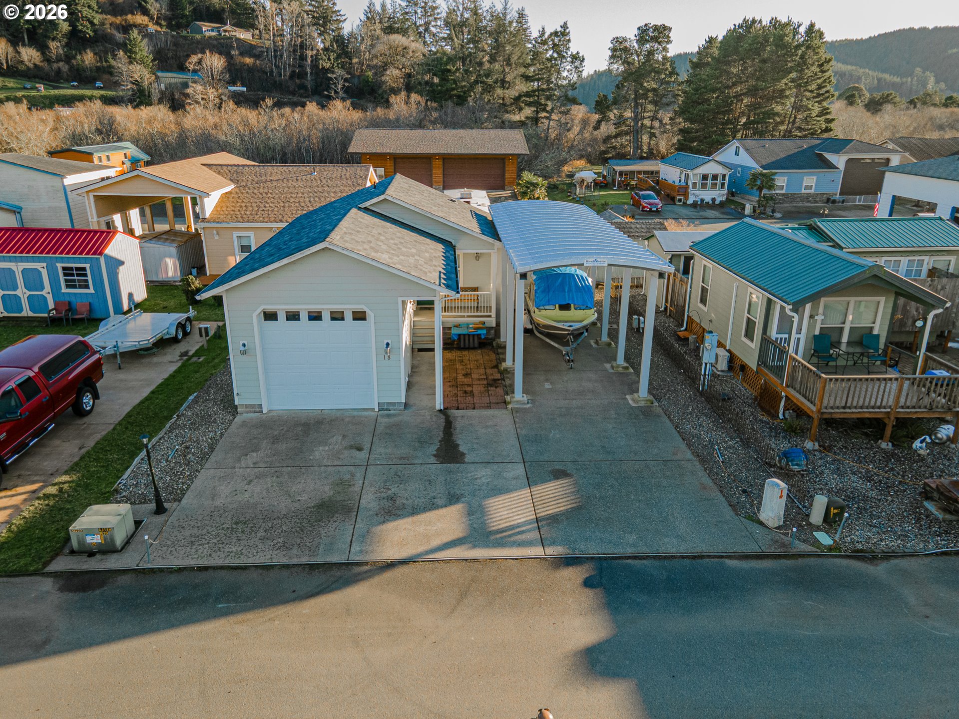 18 Pine Lane Lakeside, OR 97449 - Photo 30 of 33 an aerial view of a house with a yard