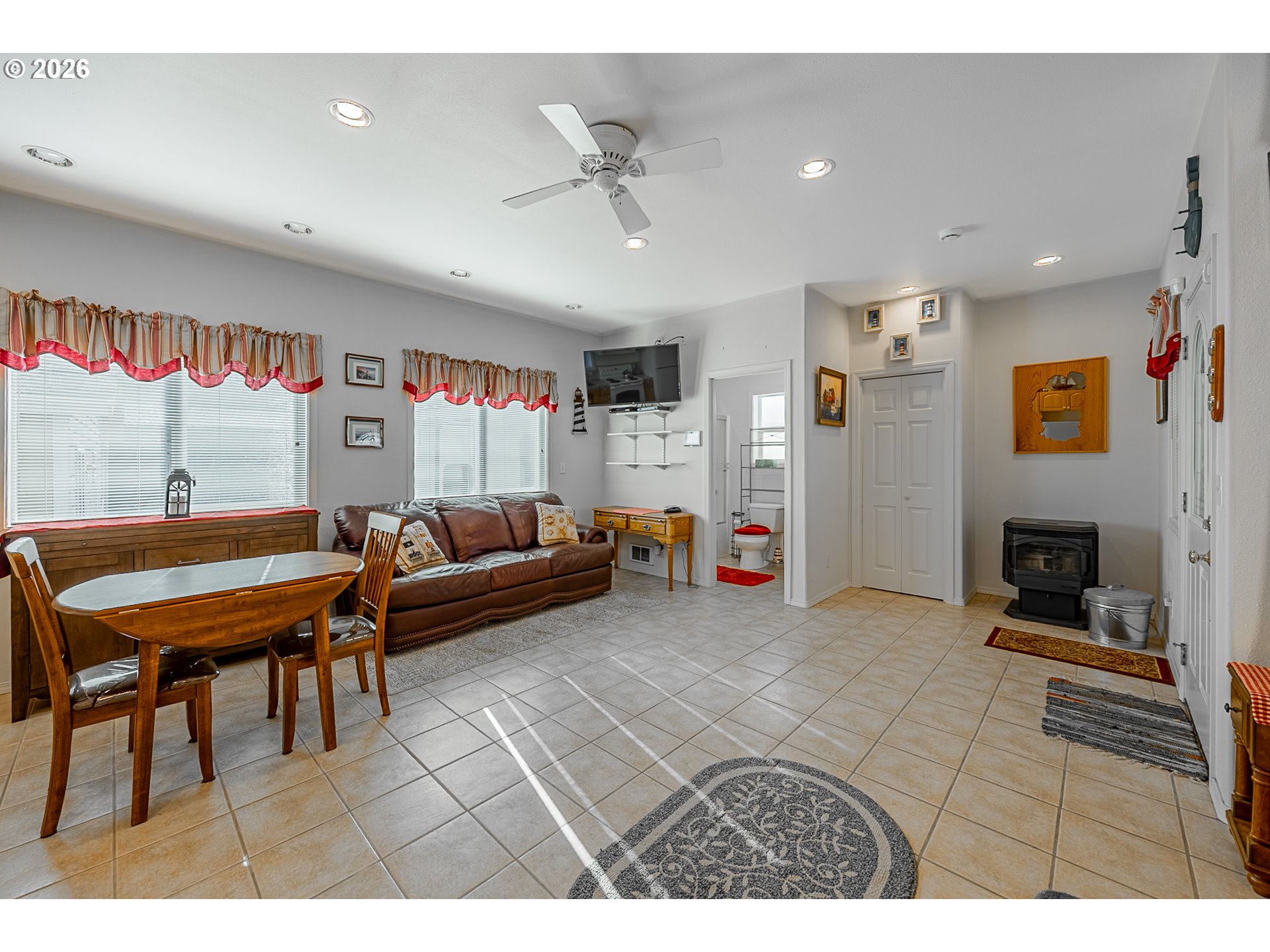 18 Pine Lane Lakeside, OR 97449 - Photo 3 of 33 a living room with furniture and a flat screen tv