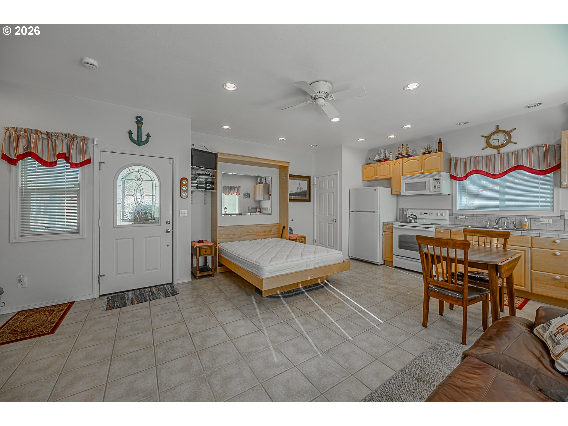 18 Pine Lane Lakeside, OR 97449 - Photo 7 of 33 a living room with furniture a rug and a chandelier