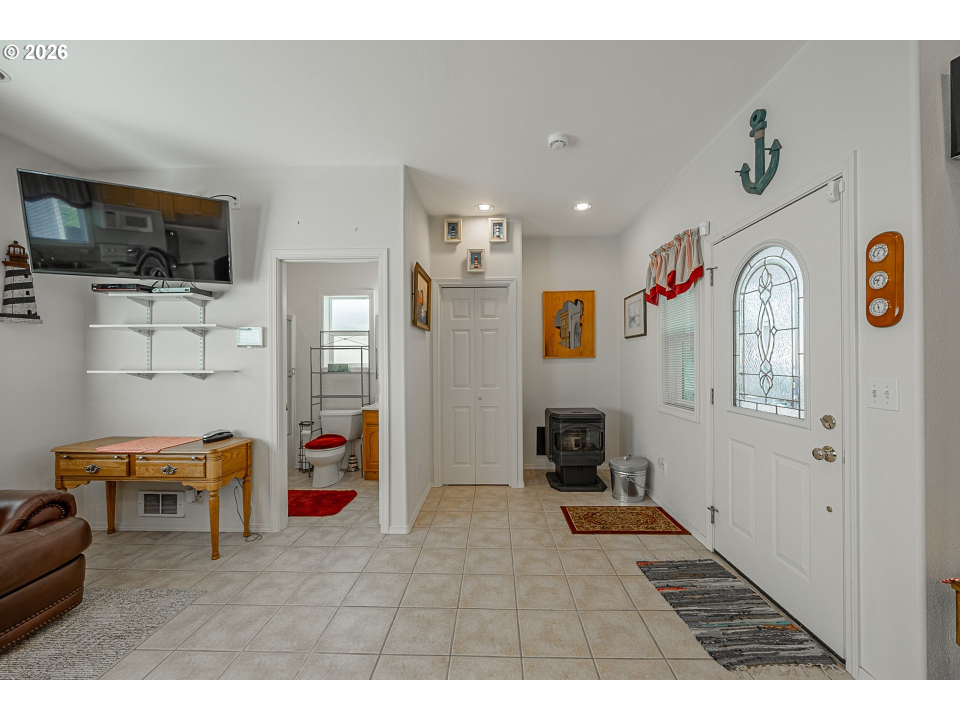 18 Pine Lane Lakeside, OR 97449 - Photo 10 of 33 a living room with furniture and a flat screen tv