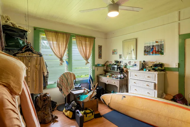 a room with furniture a flat screen tv and a window