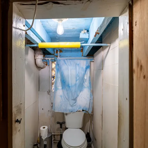 a bathroom with a toilet and a sink