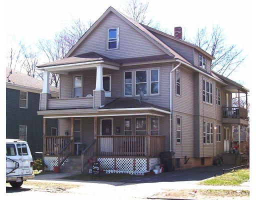 497-99 Wilbraham Road Springfield, MA 01109 - Photo 1 of 1 a front view of a house with a yard
