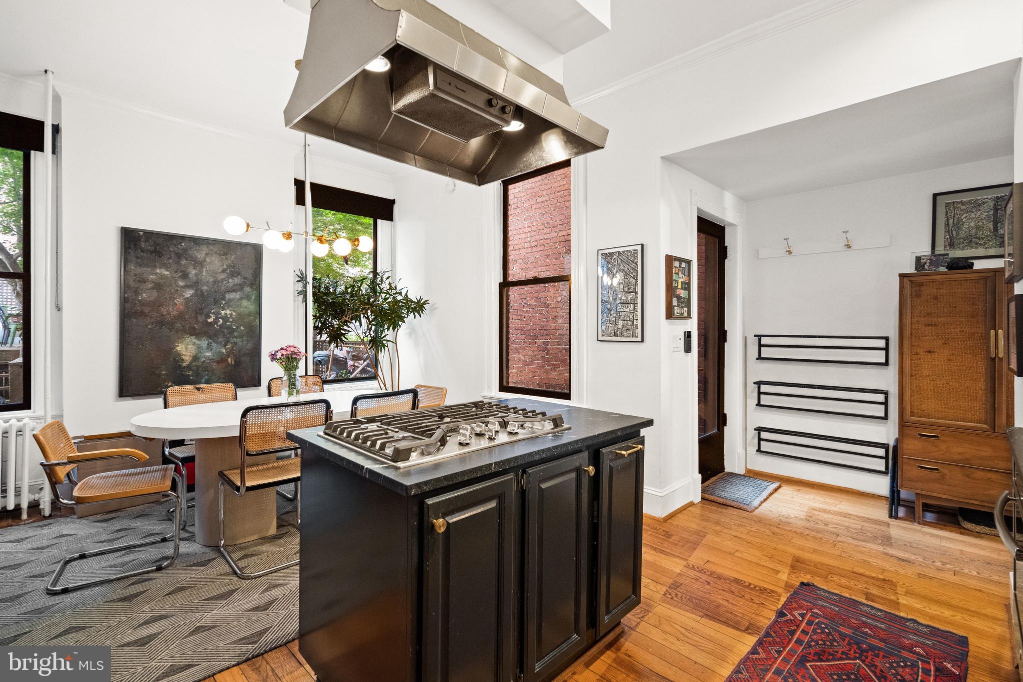 2026 15th Street Northwest Washington, DC 20009 - Photo 13 of 47 a kitchen that has a table chairs and a stove