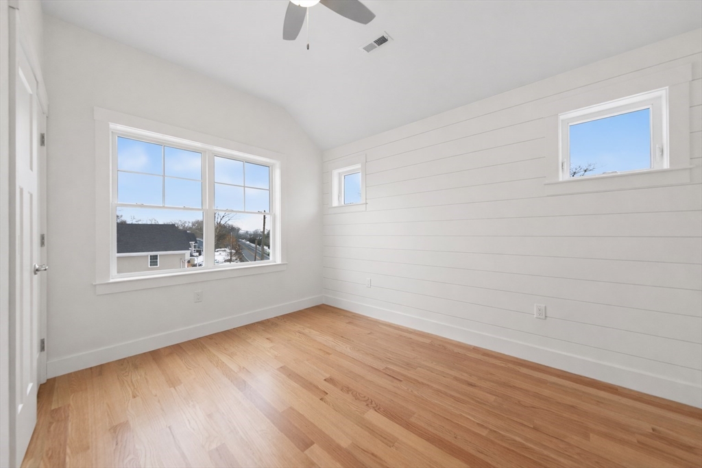 2 Old County Road, Unit 10 Salisbury, MA 01952 - Photo 9 of 27 a view of an empty room with wooden floor and a window