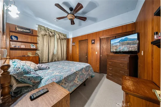 a bedroom with a bed and a table