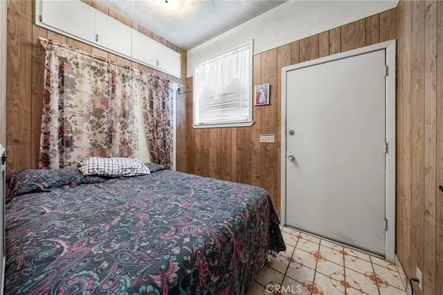 a view of a backyard with chairs and a small yard