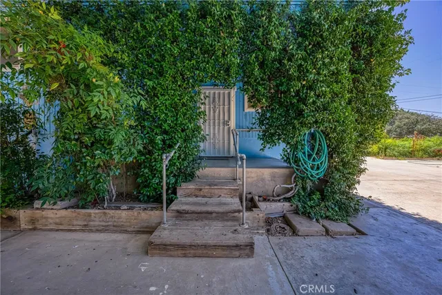 a living room with furniture a rug and a chandelier