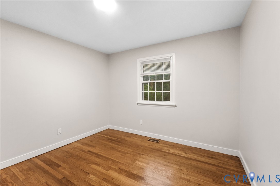 3151 Mountclair Road Chester, VA 23831 - Photo 28 of 36 Bright room with wood-finish flooring, white baseb